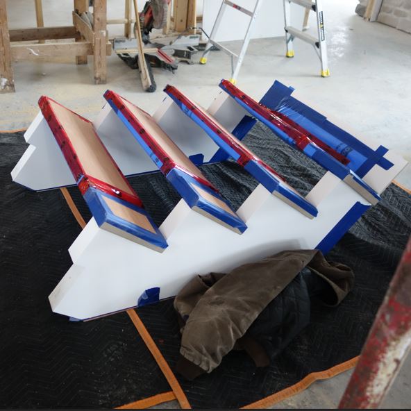Ottawa Stair Builder custom hardwood treads with box newel posts and horizontal metal balusters, and steel balustrade